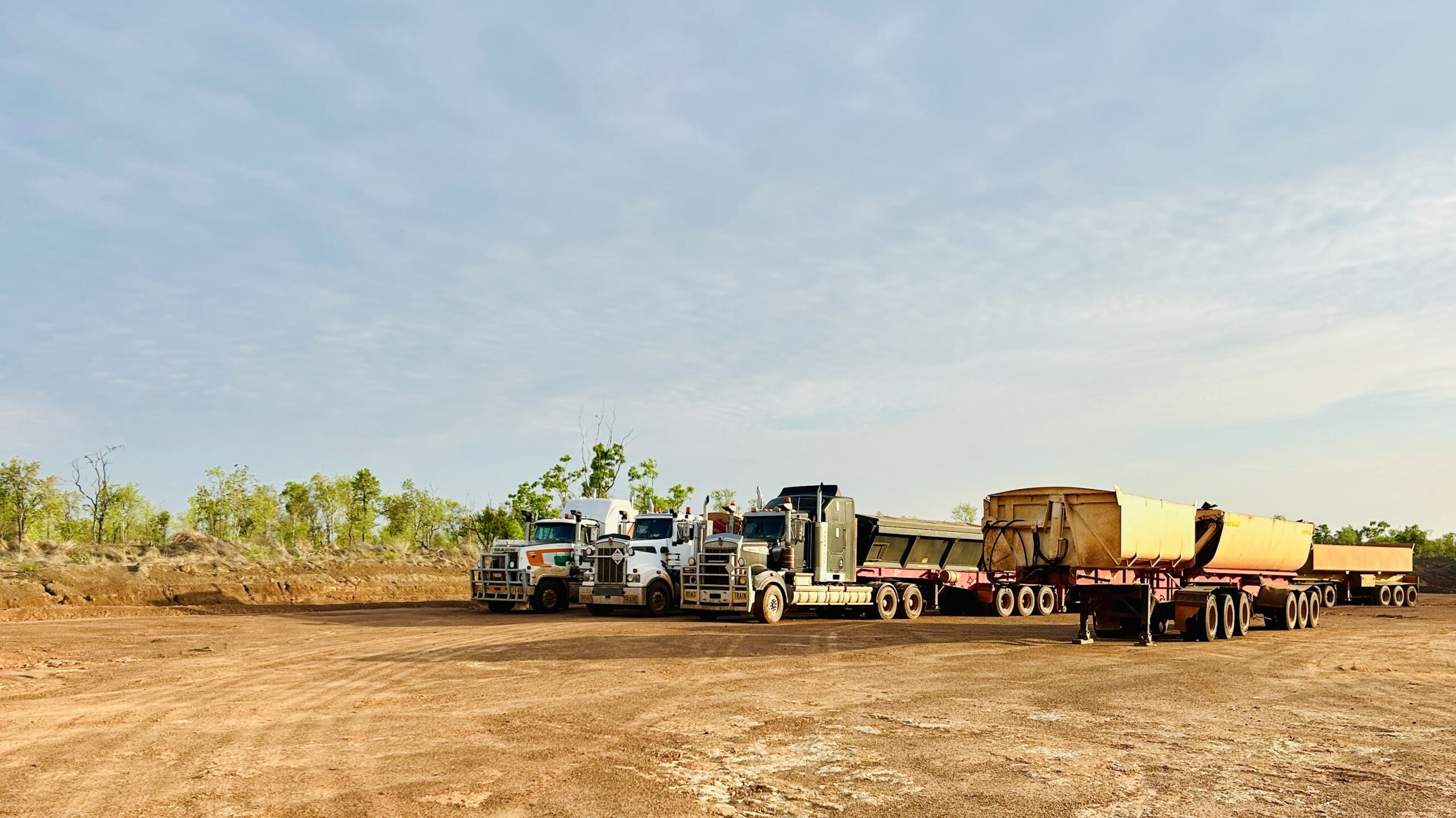 Walkabout Civil Doomadgee - 3 trucks lined up on dirt road